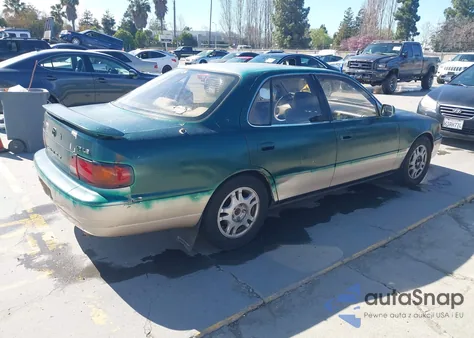 1995 Toyota Camry Le z USA, uszkodzony, nr VIN JT2GK12E7S0121238